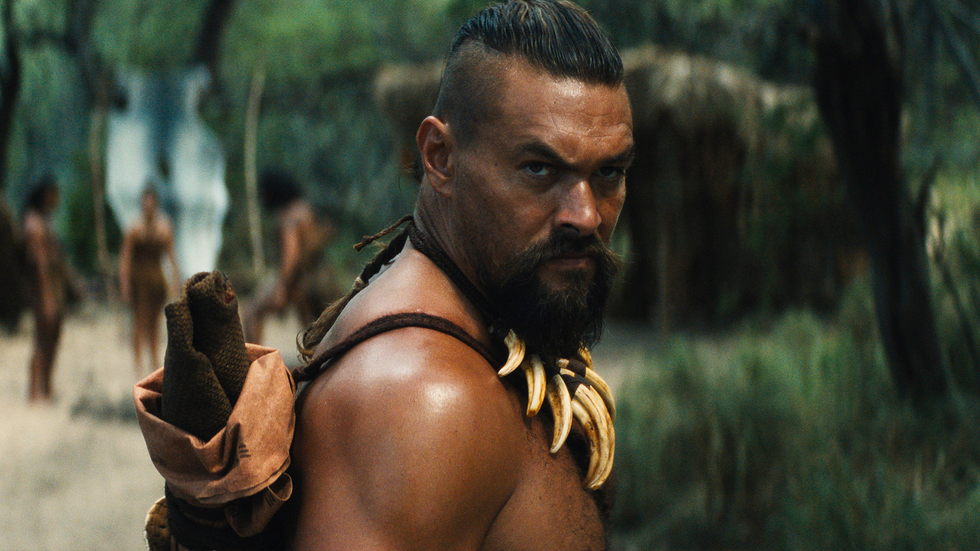 a colorful Hawaiian warrior in full native costume