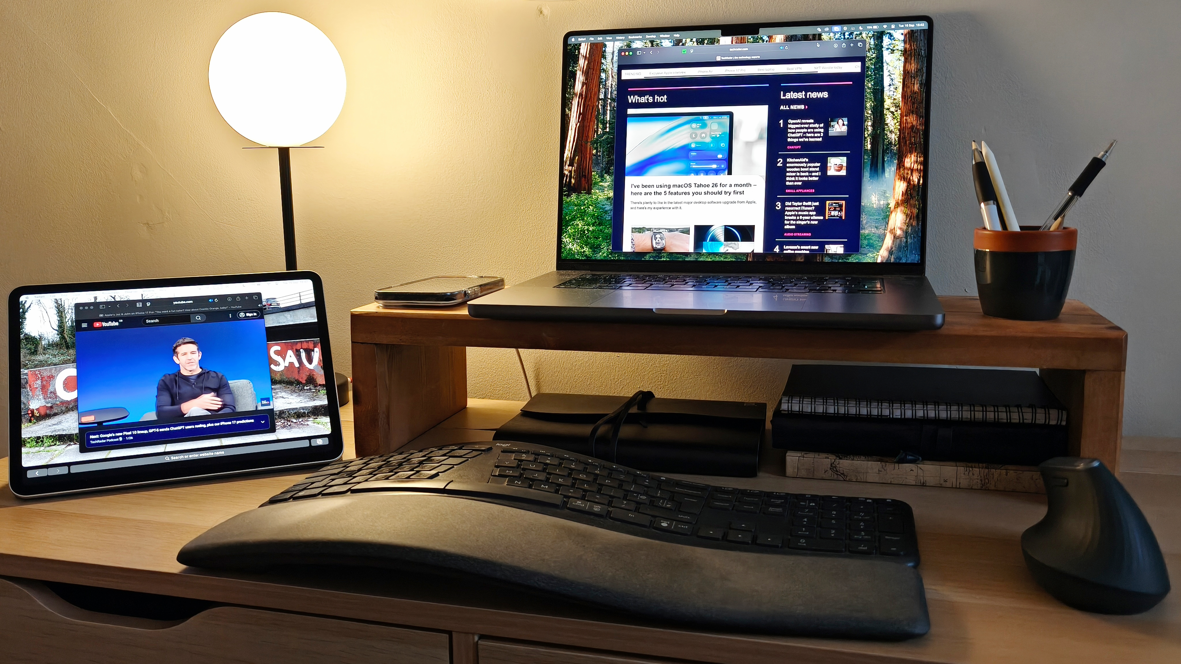 A desk setup featuring an iPad Pro and MacBook Pro using Sidecar